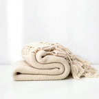 Snug Knit Woven Tassel Blanket